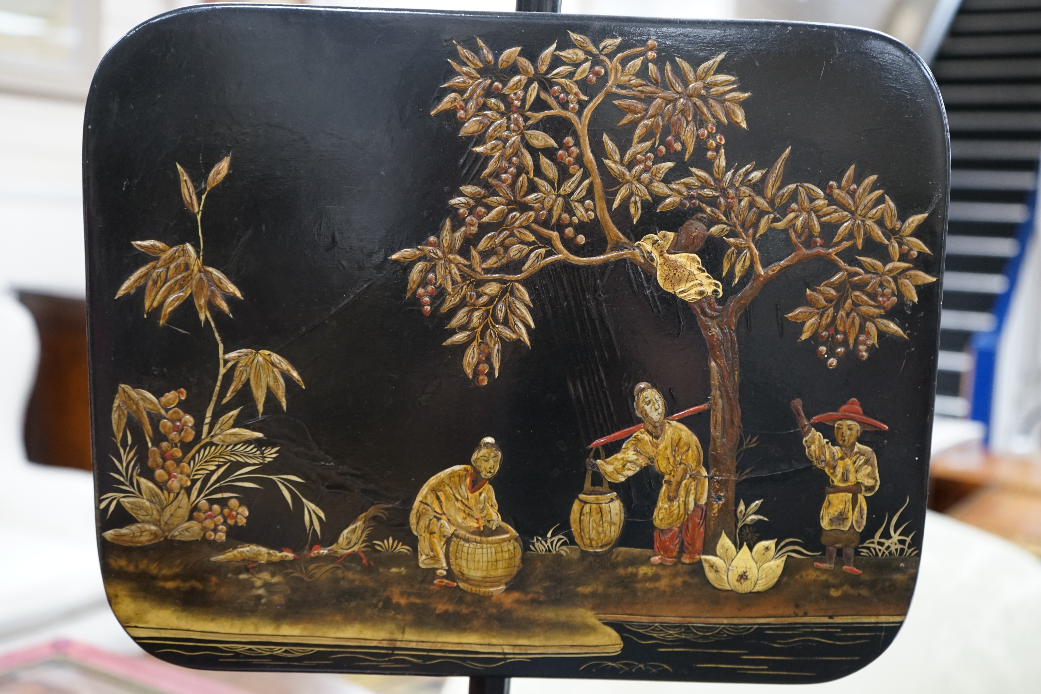 A pair of 19th century chinoiserie lacquer pole screens, height 152cm